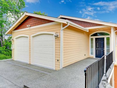 House exterior. Entrance porch with black door  and railings. House with two car garage; Shutterstock ID 230907439; PO: Zeus