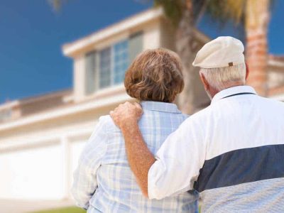 elderly-couple-looking-at-home