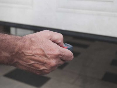 man-opening-garage-door-with-opener