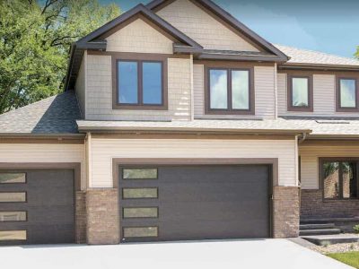 modern garage door with window on large house